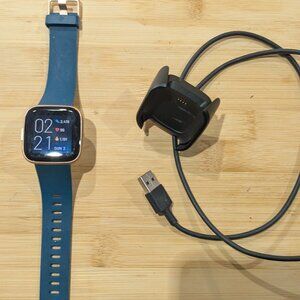 Fitbit Versa 2 Smartwatch in Green and Rose Gold watch with charger